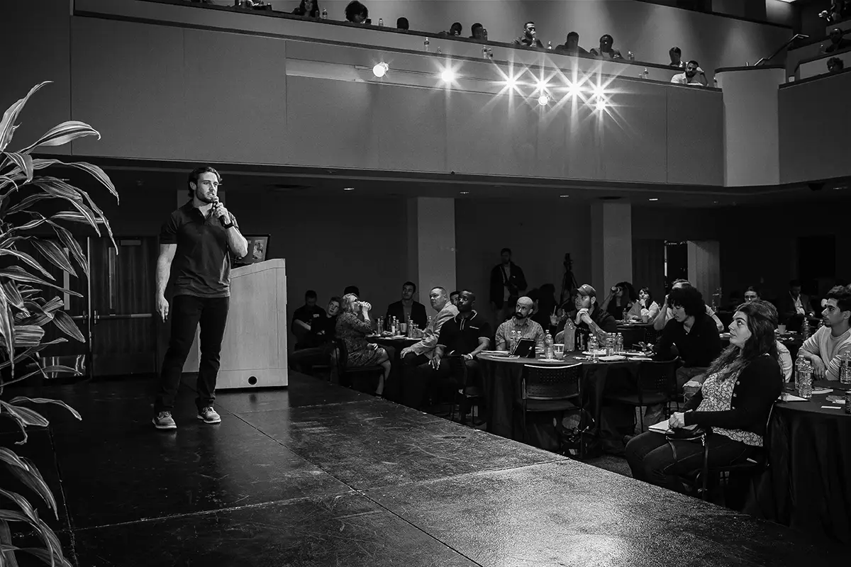 Rob Tracz on stage at A2B personal development conference in stamford connecticut teaching, motivating, and inspiring entrepreneurs, small business owners, solopreneurs, & side hustlers